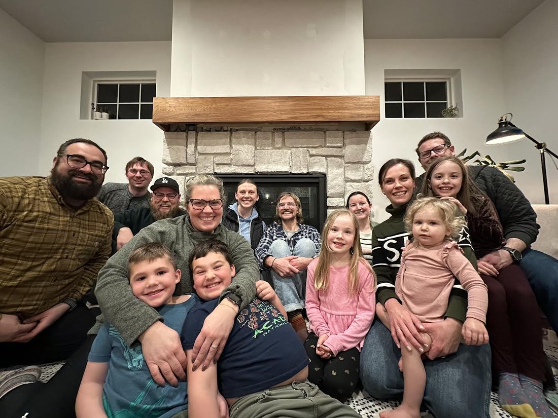 Community group gathered by the fireplace